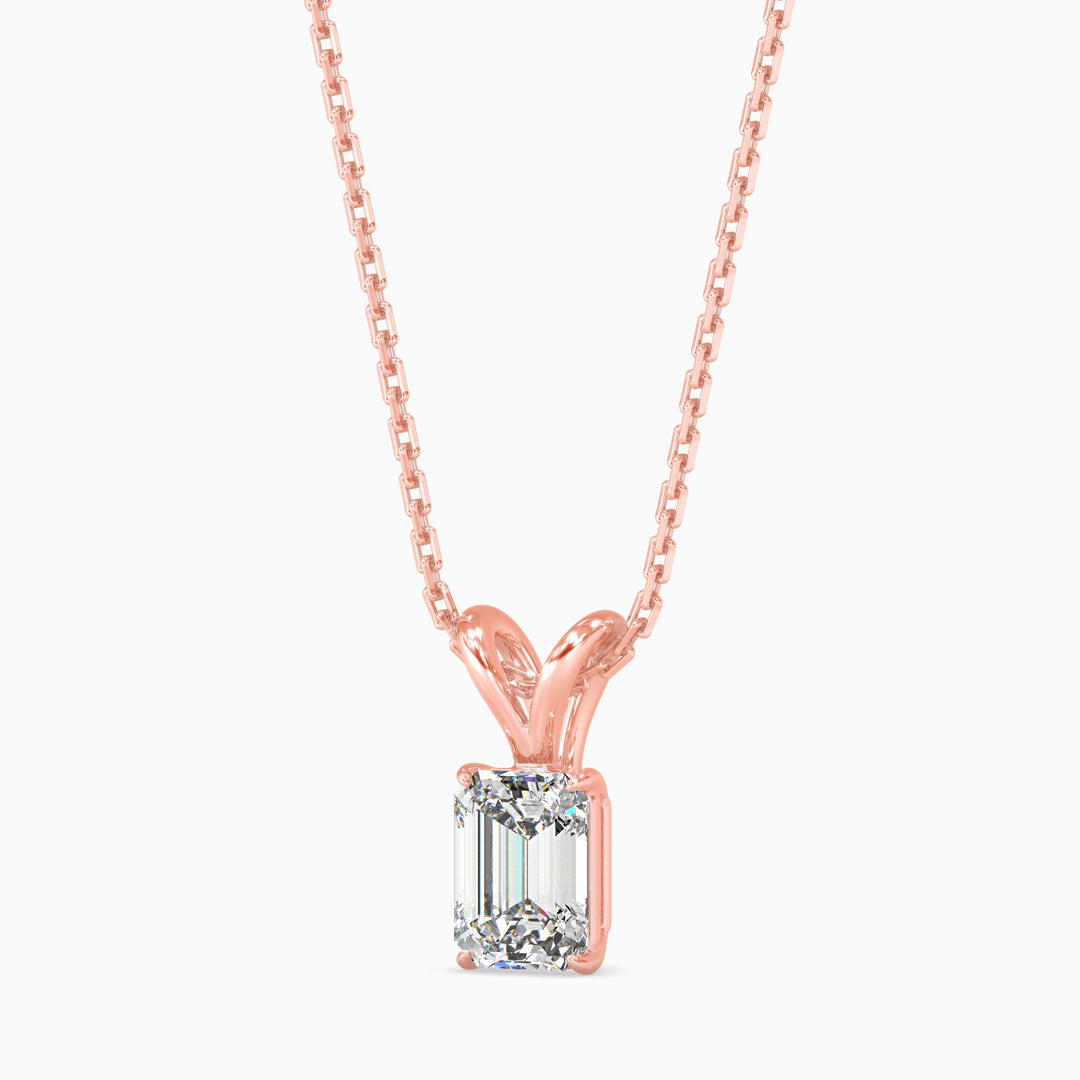 Rose gold necklace with a diamond pendant on a white background