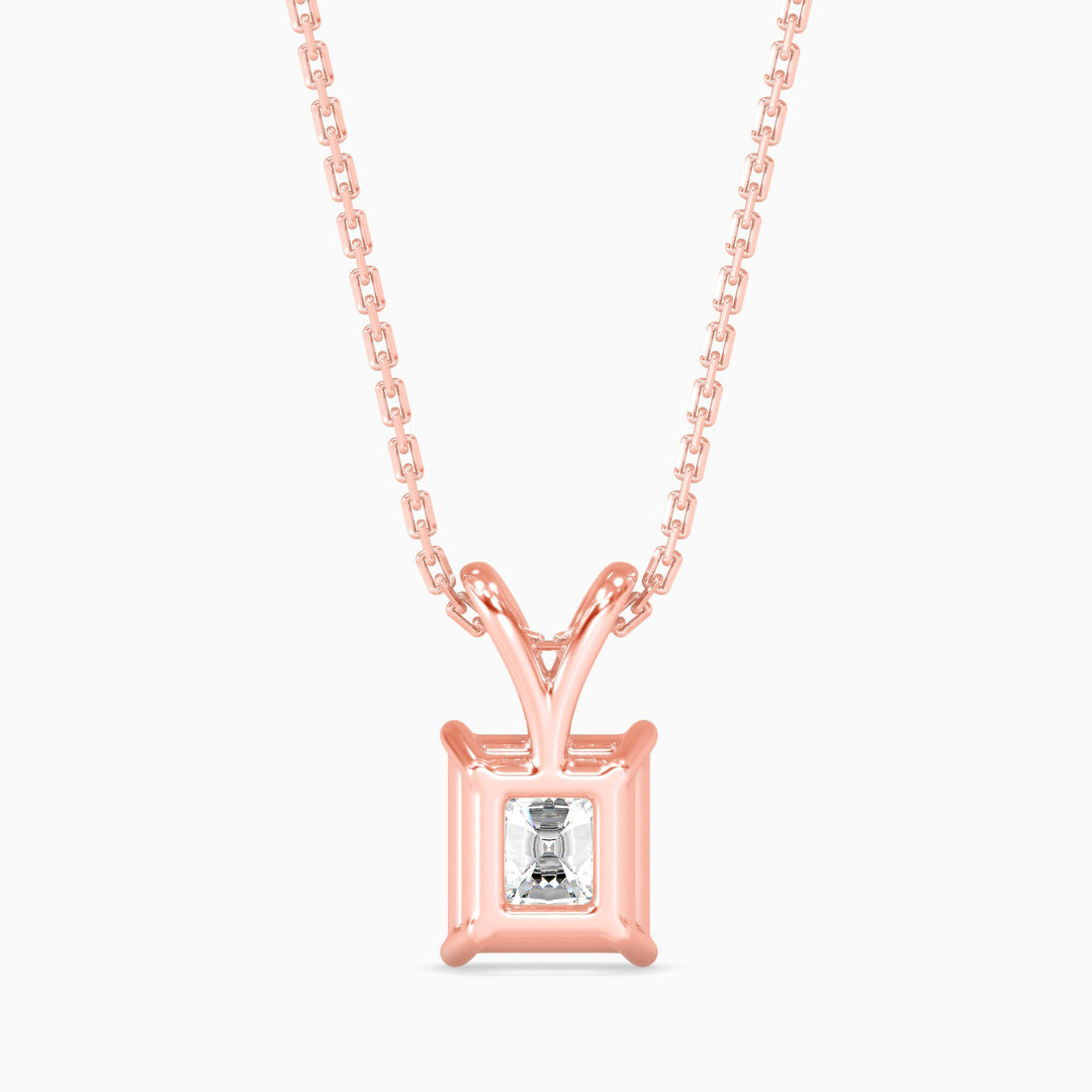 Rose gold necklace with a diamond pendant on a white background
