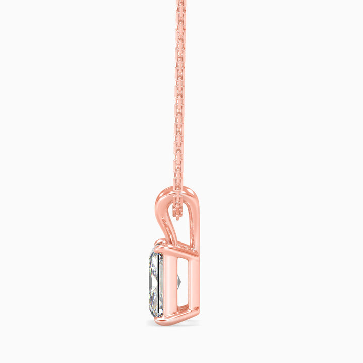 Rose gold necklace with a pendant on a white background