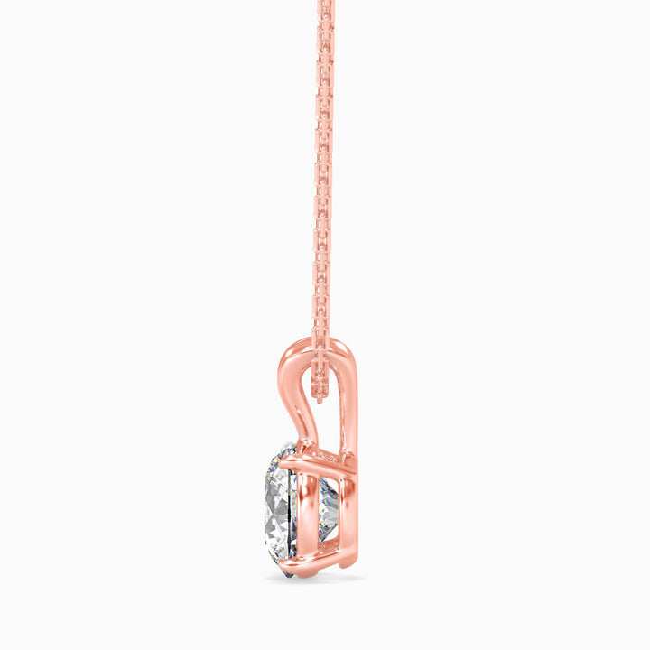 Rose gold necklace with a clear gemstone on a white background