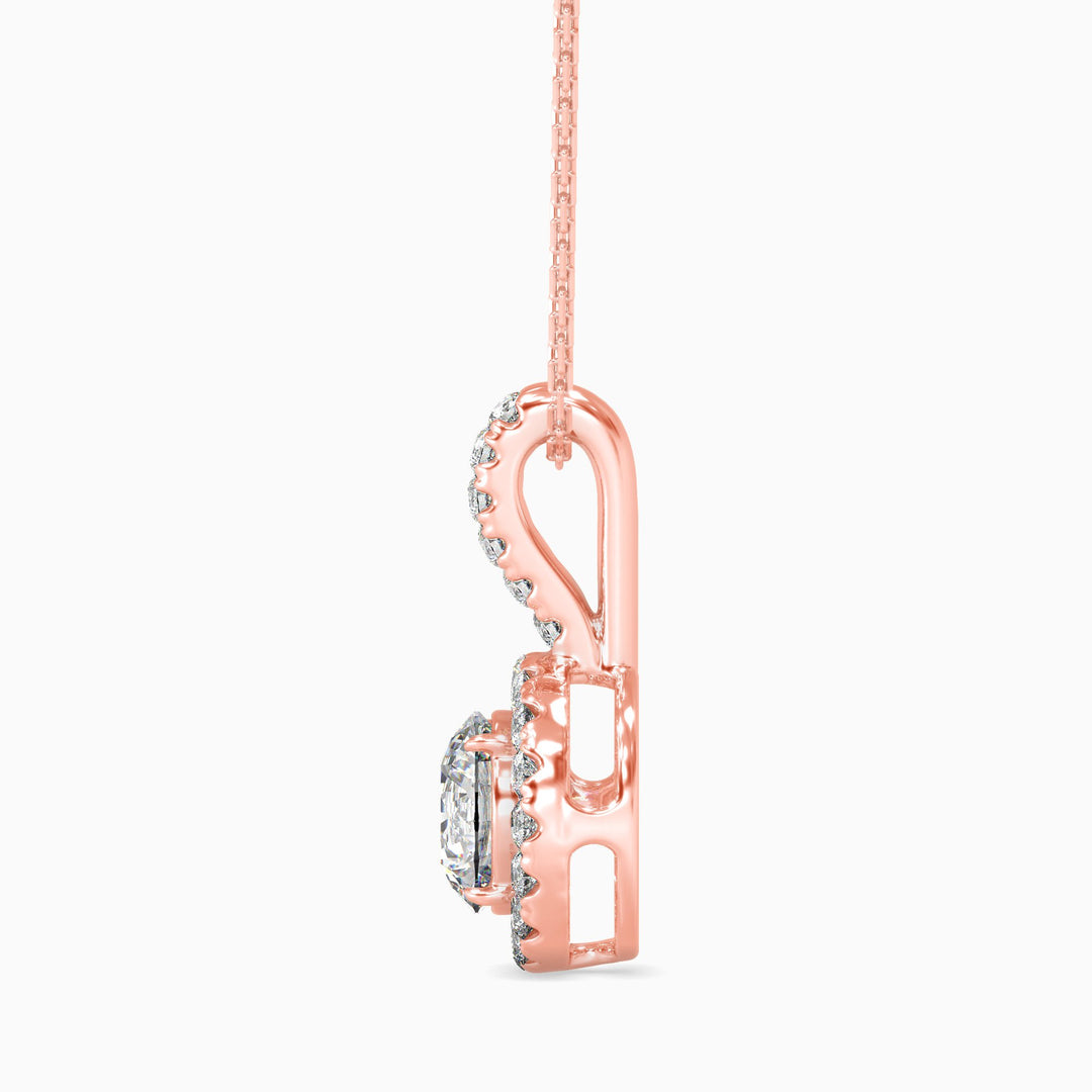 Rose gold necklace with a unique pendant design on a white background