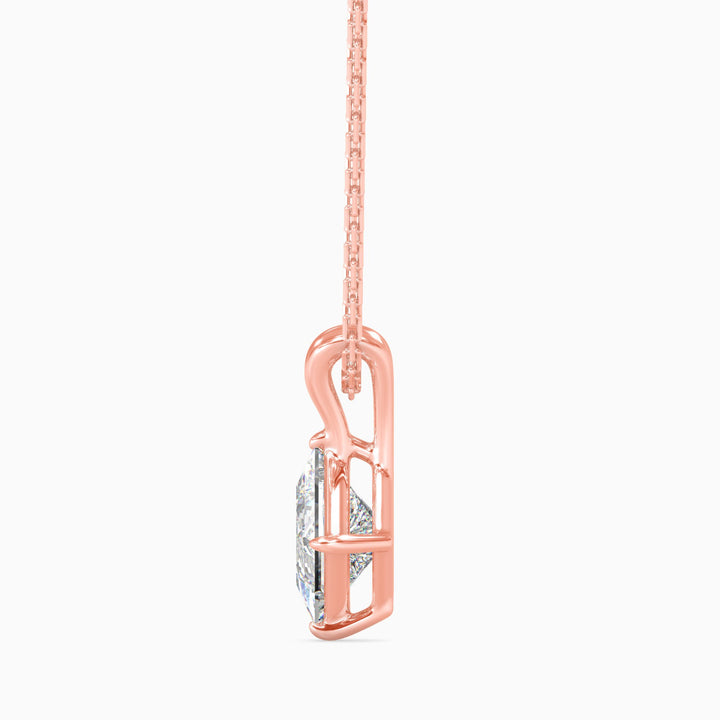 Rose gold necklace with a diamond pendant on a white background