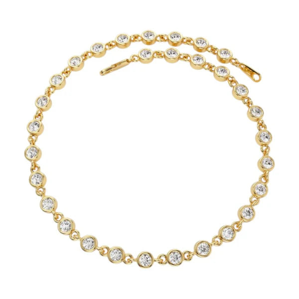 Gold bracelet with clear beads on a white background