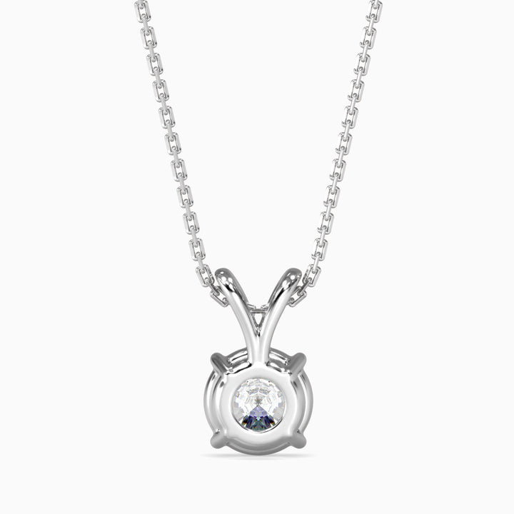 Silver necklace with a round pendant on a white background