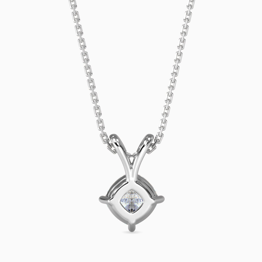 Silver necklace with a heart-shaped diamond pendant on a white background
