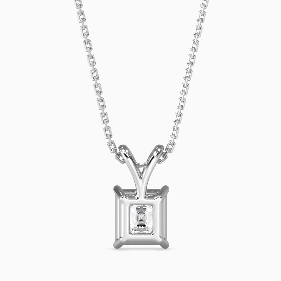 Silver pendant necklace with a diamond on a white background