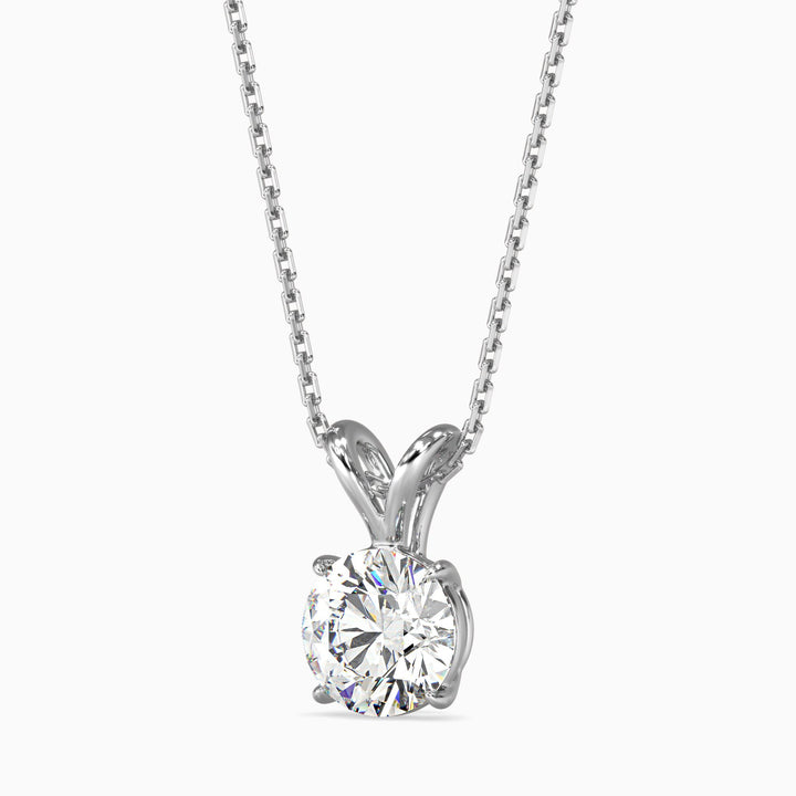 Diamond pendant on a chain against a white background