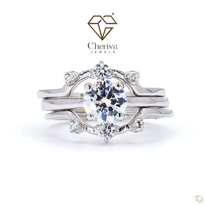 Silver ring with a large central gemstone and smaller diamonds on a white background, featuring the Cheriva Jewels logo.