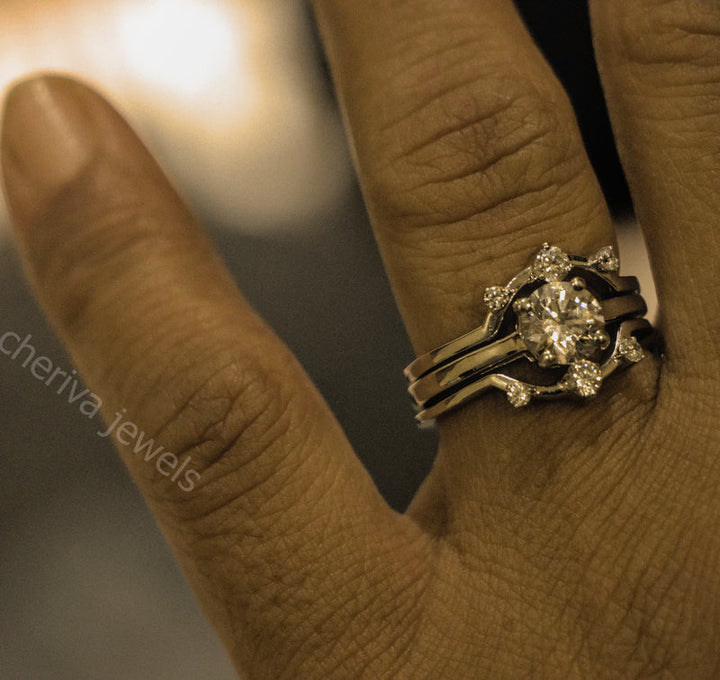 Close-up of a hand wearing a decorative ring with 'cheriva jewels' branding.