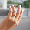 Lab grown diamond engagement ring holds pear cut side stone.