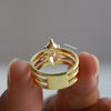 Marquise cut diamond engagement ring with pear cut side stone.