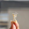 Pear cut diamond ring In hidden halo style.