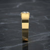 thick band ring in yellow gold.
