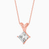 Rose gold necklace with a diamond pendant on a white background