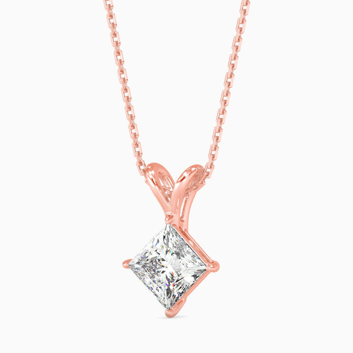 Rose gold necklace with a diamond pendant on a white background