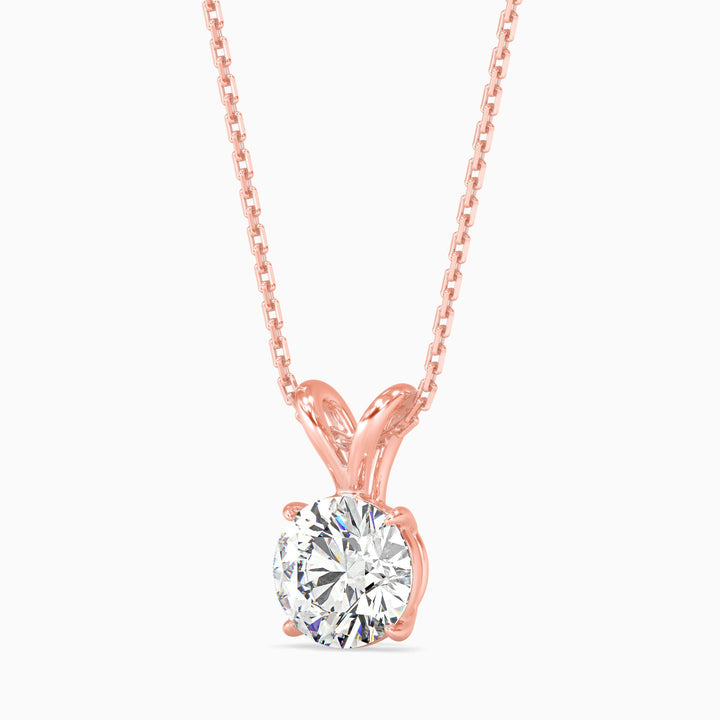 Rose gold necklace with a diamond pendant on a white background