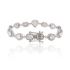 Diamond bracelet with various gemstone shapes on a white background