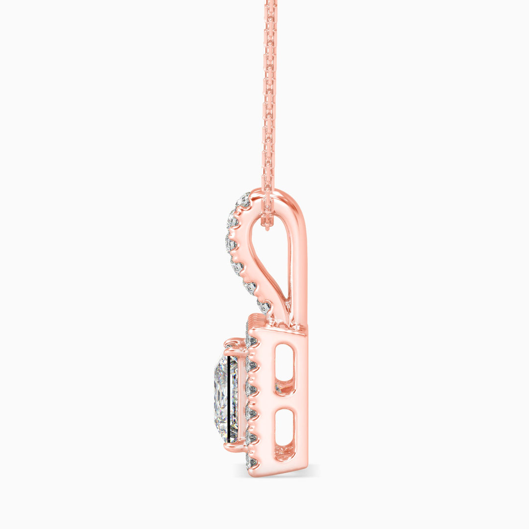 Rose gold necklace with a unique pendant design on a white background