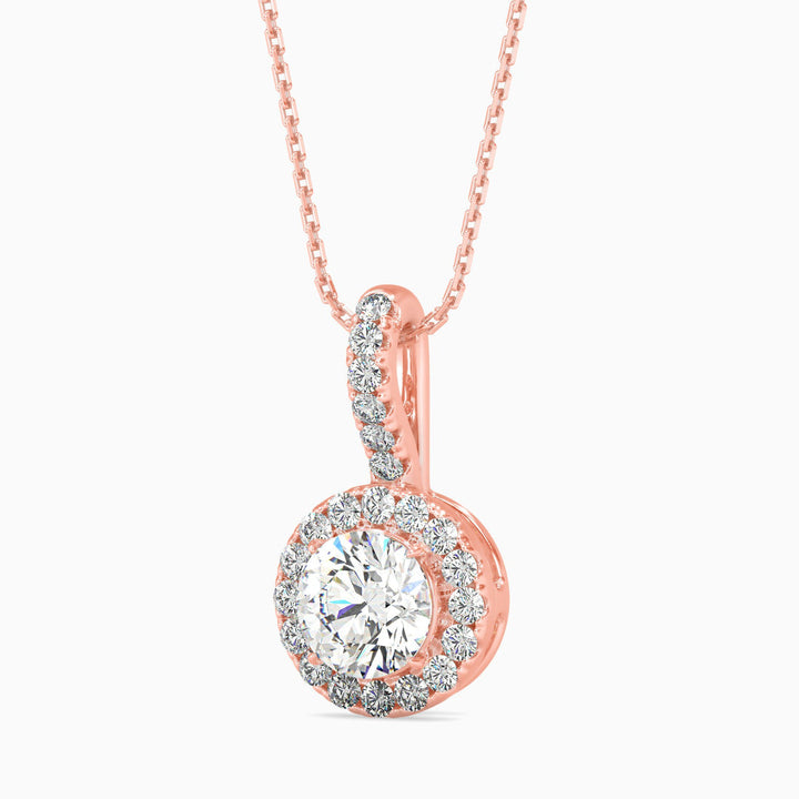 Rose gold diamond pendant on a white background